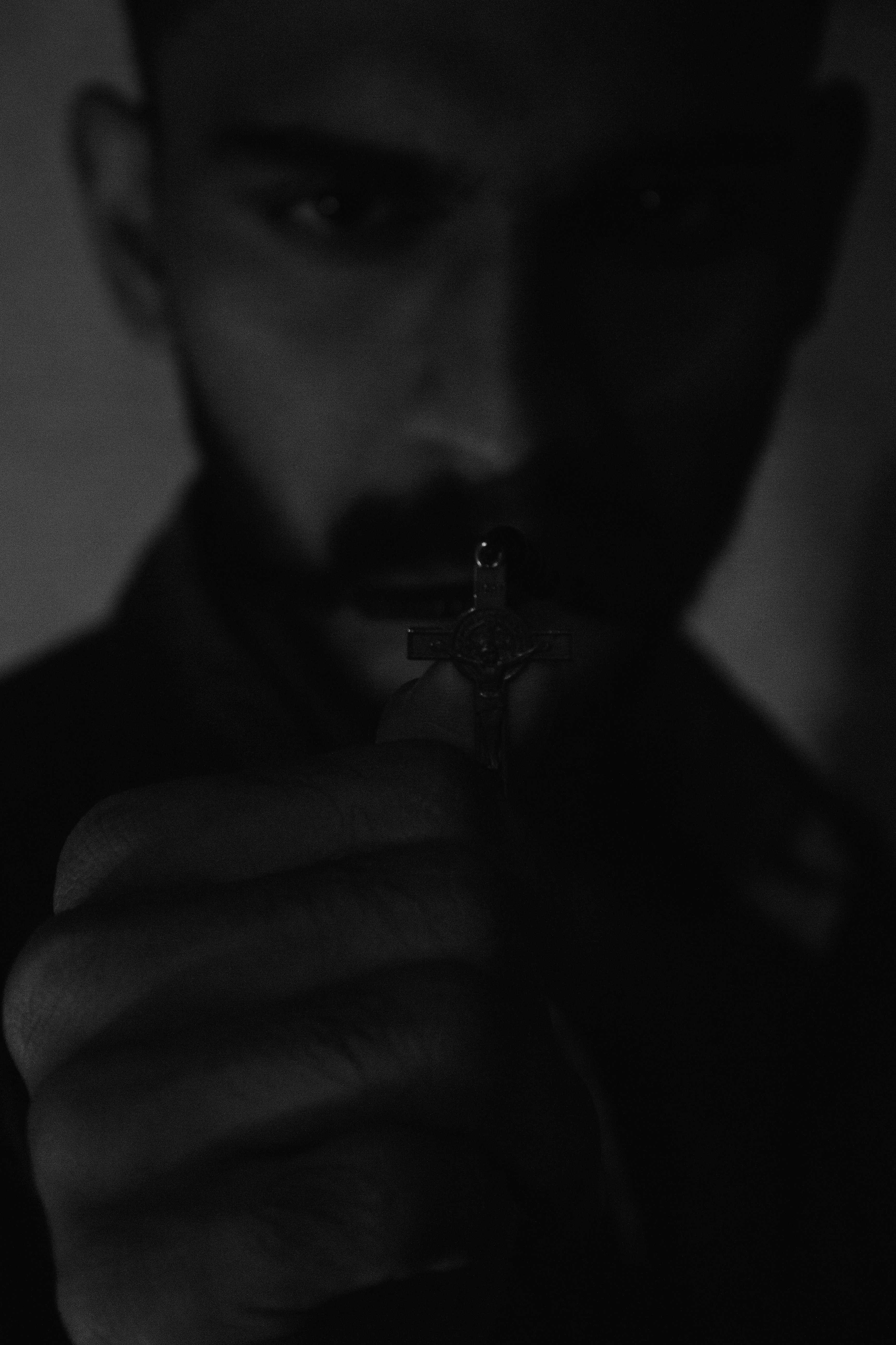 man smoking cigarette in grayscale photography